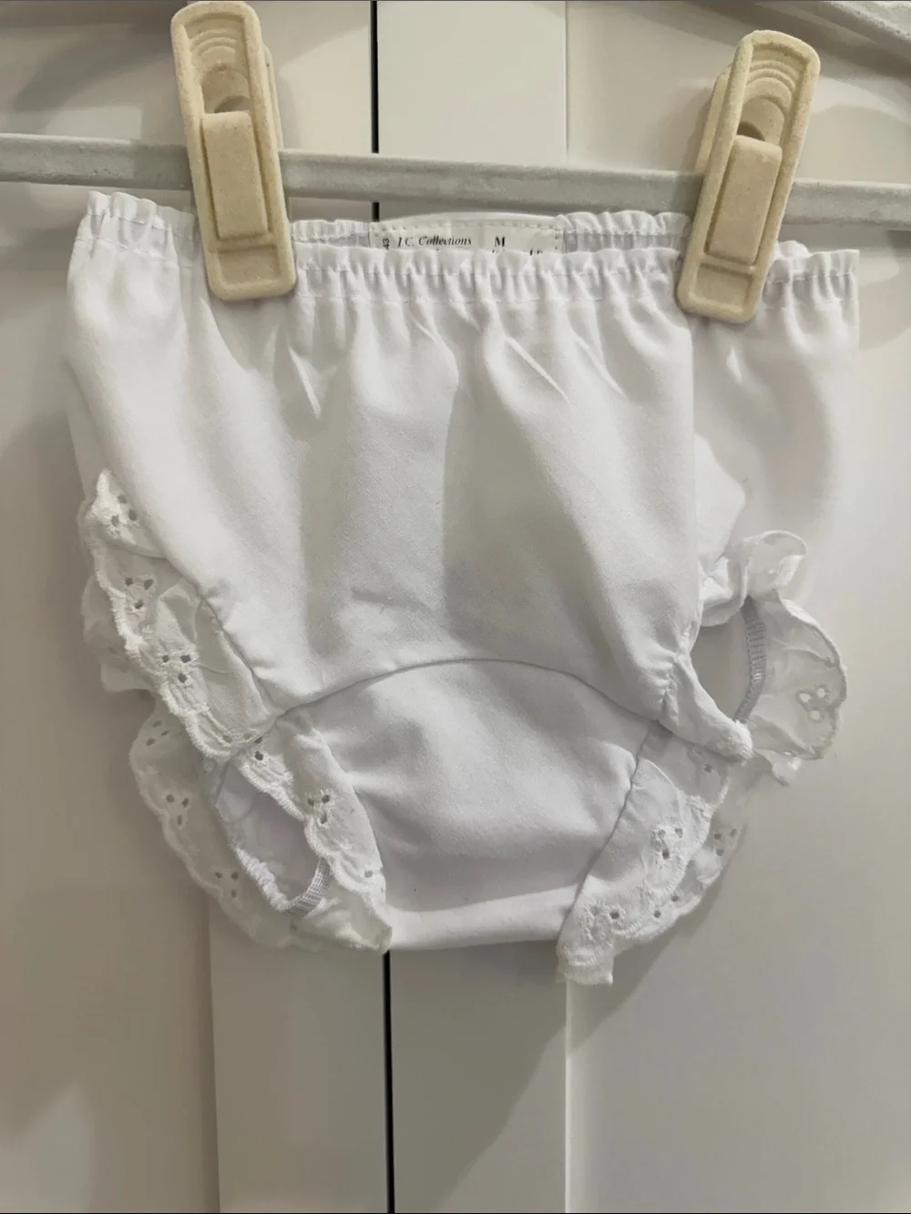Pair of IC COLLECTIONS White Ruffle Diaper Covers w/ “C” Floral Monograms